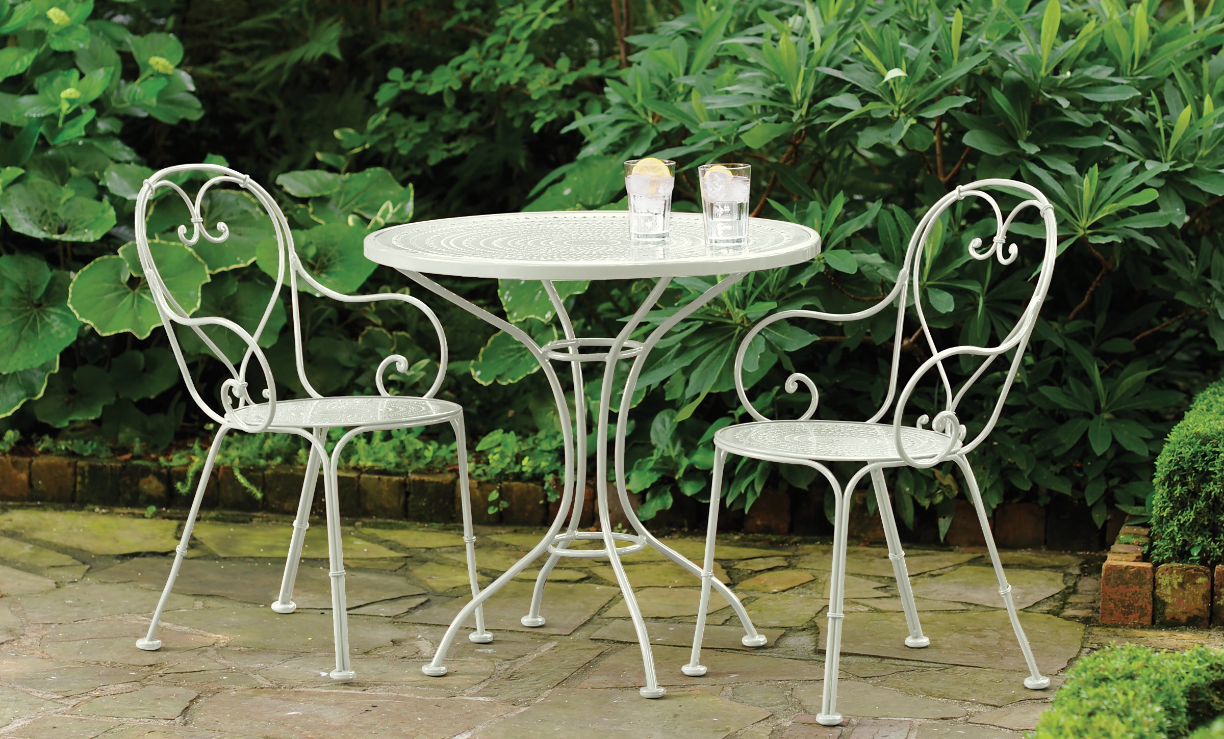 green wrought iron table and chairs